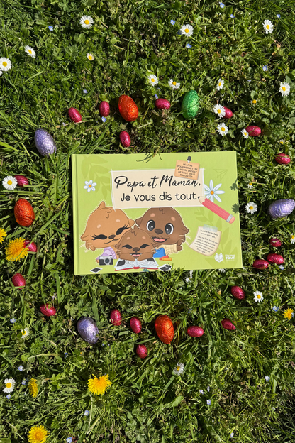 Livre papa et maman, je vous dis tout photo dans l'herbe avec des chocolats autour
